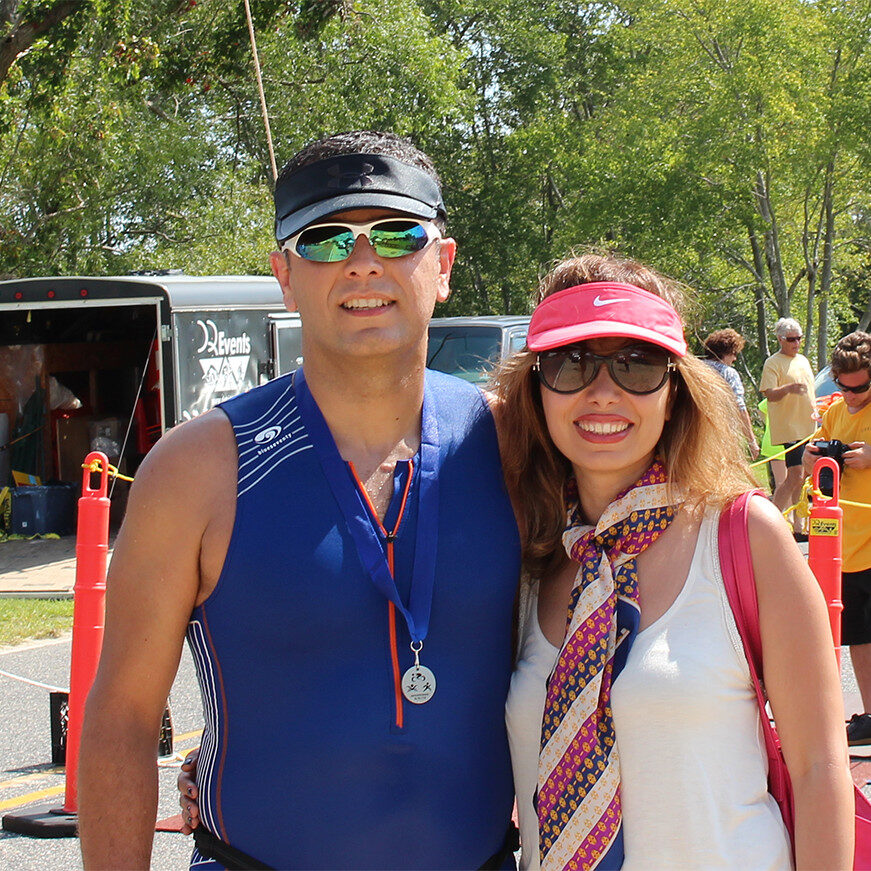 Dr. Payam with his wife after he completes a triathlon.
